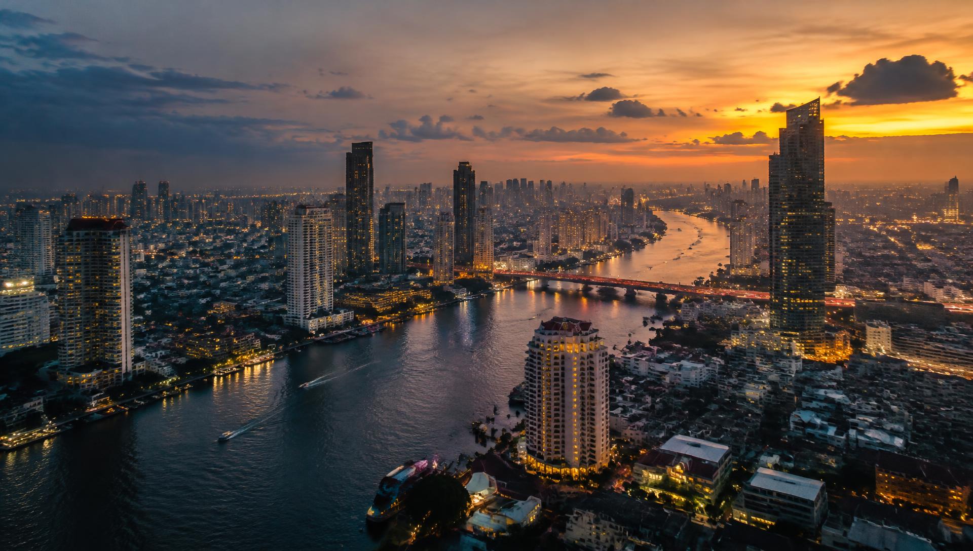 Bangkok skyline along the Chao Phraya River at dusk